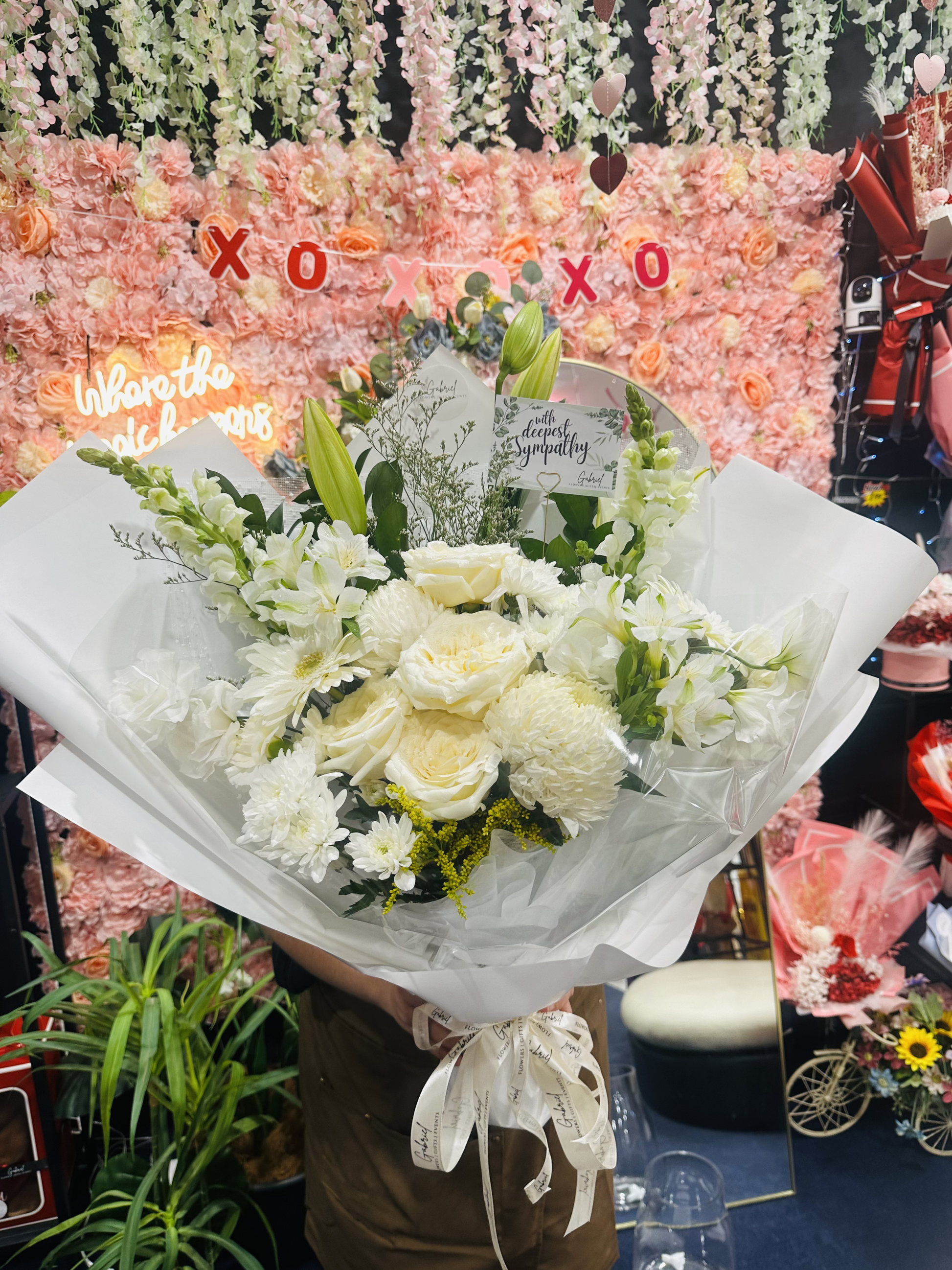 Pure Grace Bouquet featuring fresh white roses, fragrant lilies, chrysanthemums, and premium seasonal flowers beautifully handcrafted in an elegant bouquet.